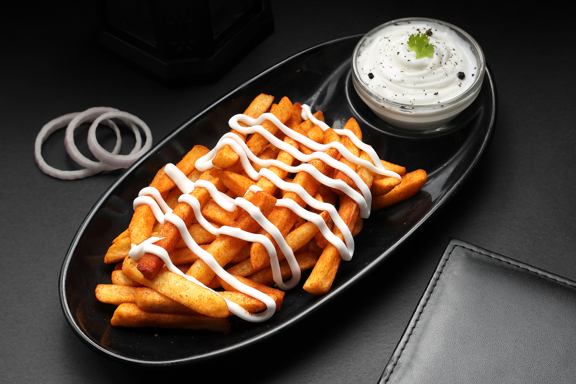 French fries food photography with creamy dip and dramatic studio lighting