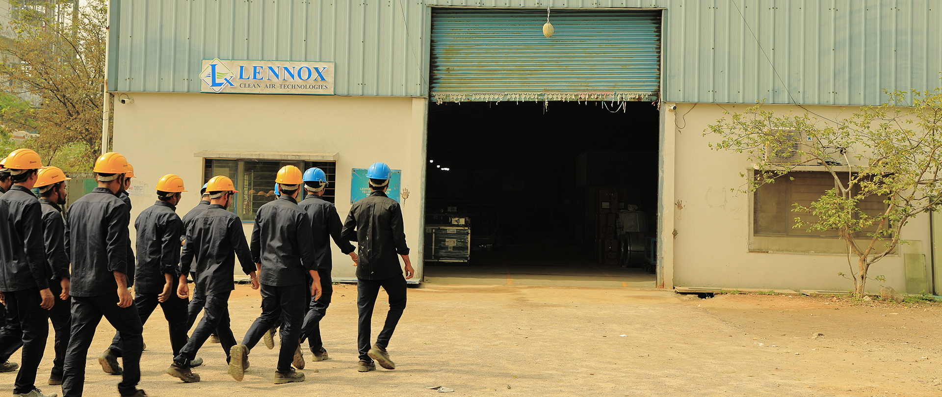 Industrial team outside factory entrance during commercial industrial photography shoot