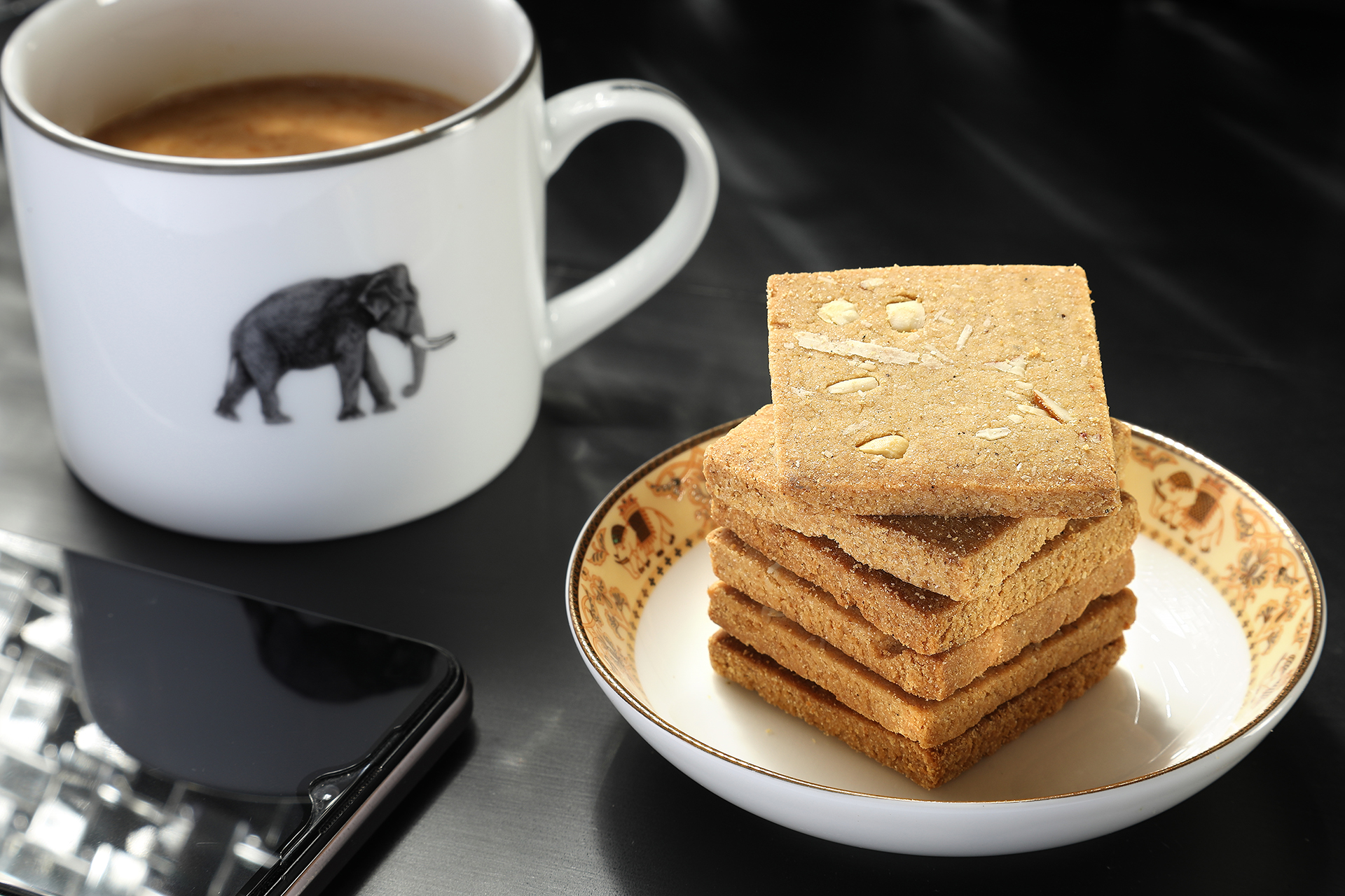 Tea and biscuit food product photography with warm lighting and clean composition