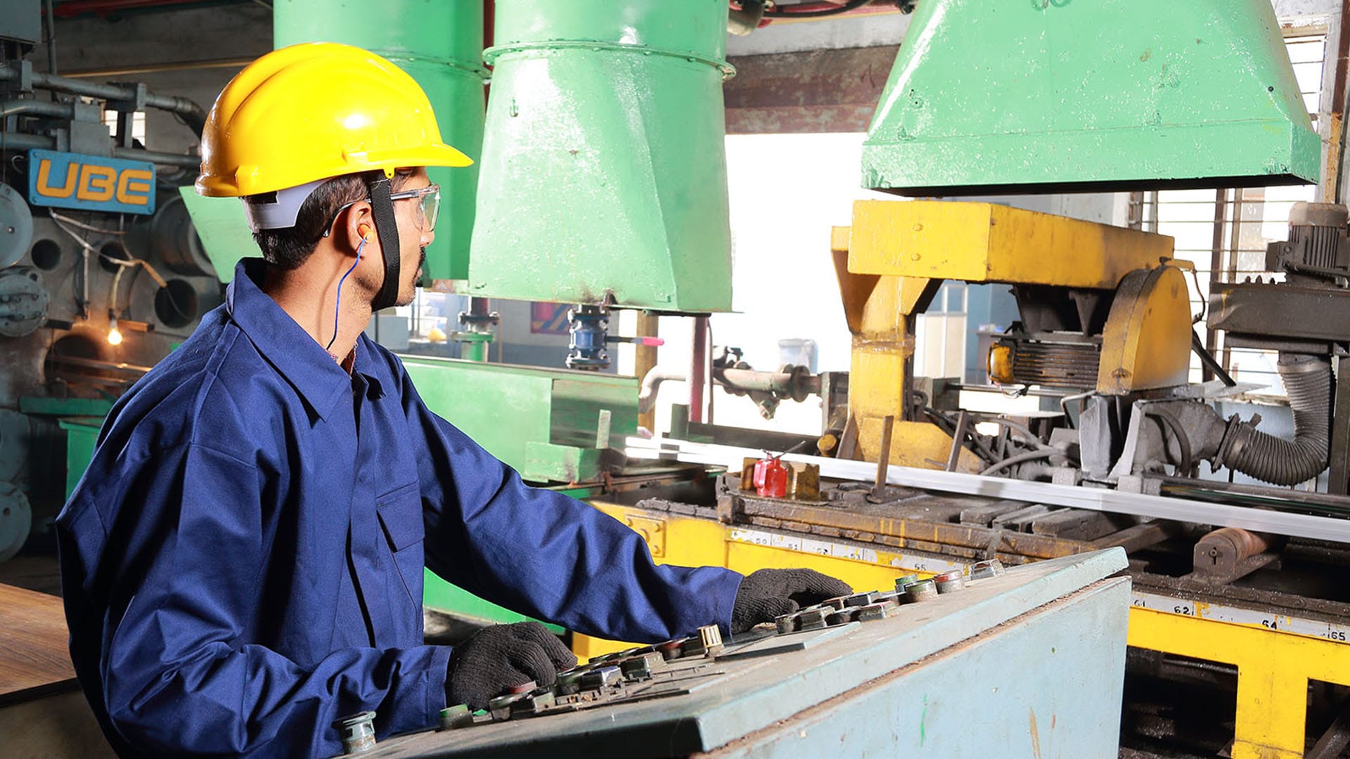 industrial machine operator manufacturing facility photography